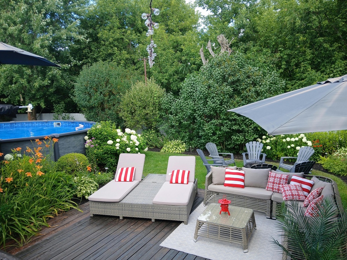 wooden deck beside an above-ground pool
